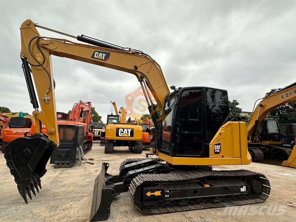 CAT 310 Roomikekskavaatorid