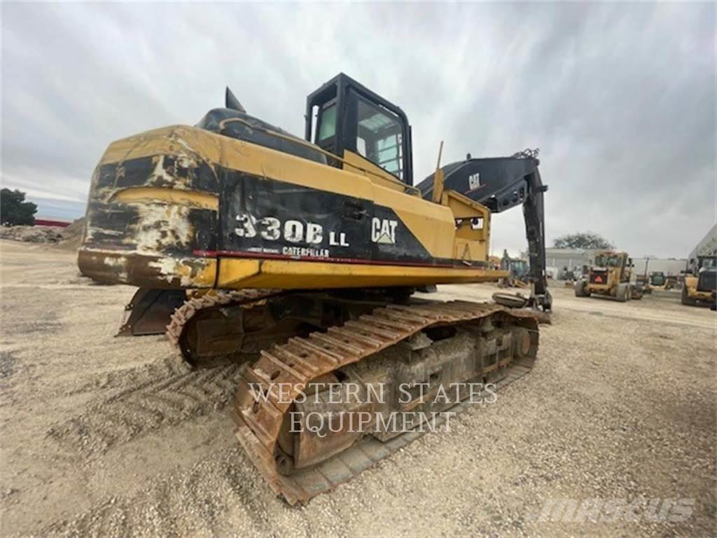 CAT 330B FM Metsatööks kohandatud traktorid