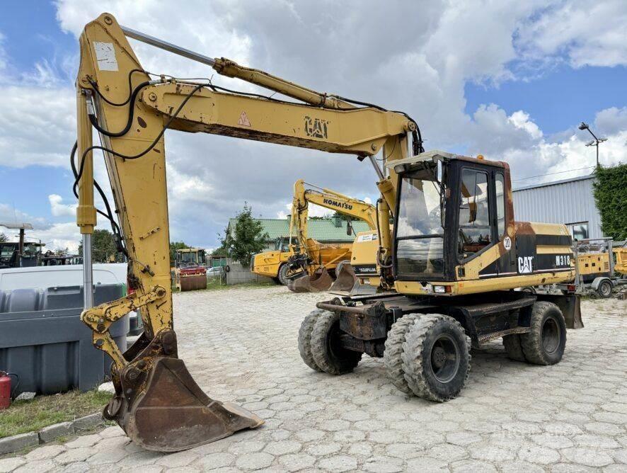 CAT M318 Ratasekskavaatorid