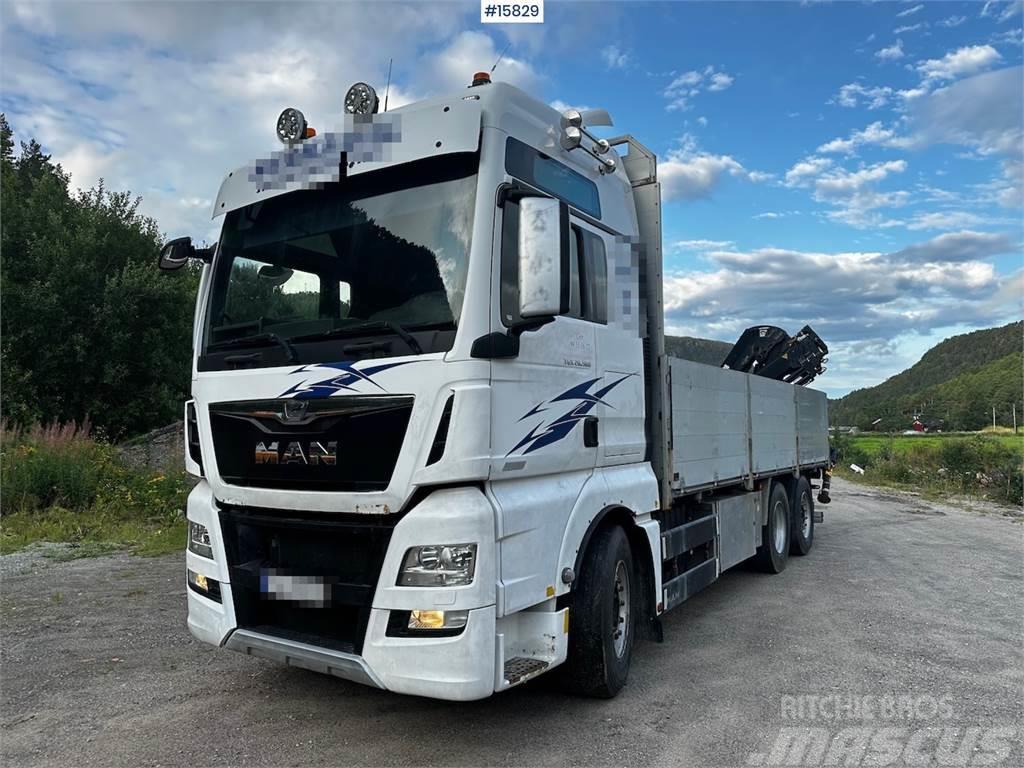 MAN TGX 26.560 Flatbed truck with Hiab 138 crane from  Madelautod