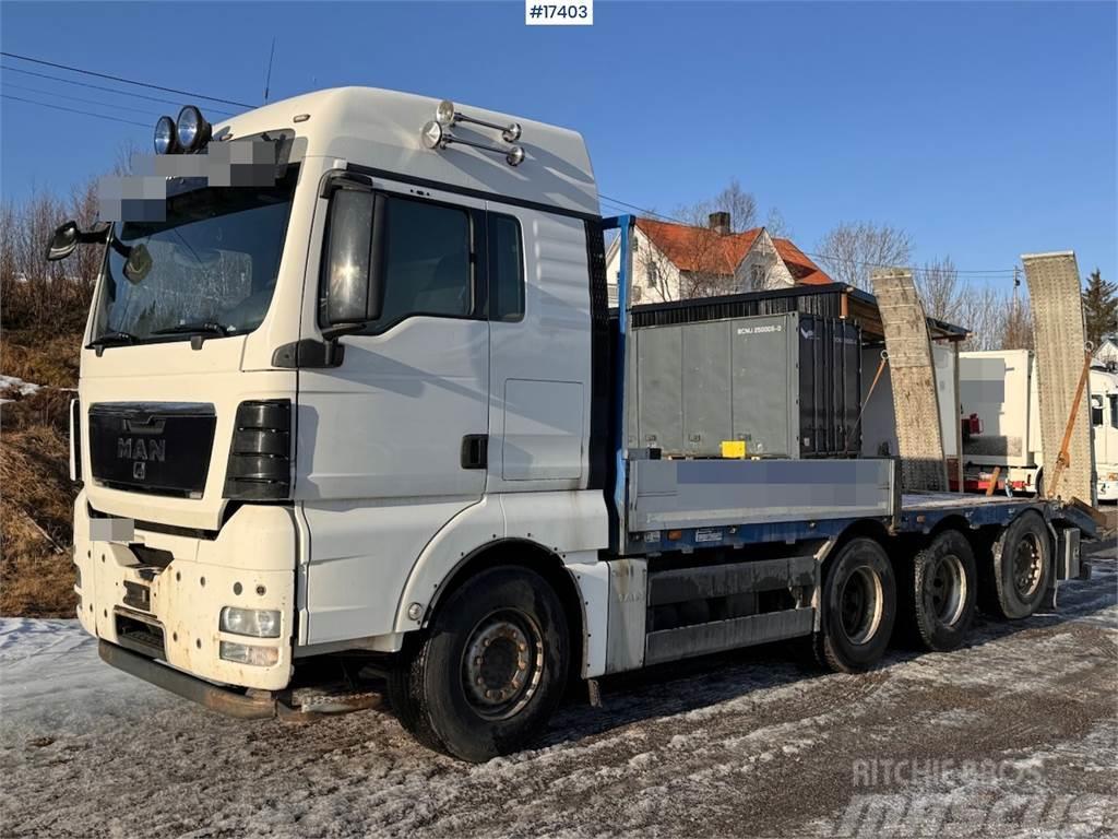 MAN TGX 35.480 8x4 flatbed truck w/ driving bridges Madelautod
